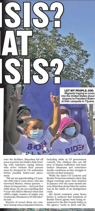  ??  ?? LET MY PEOPLE JOE:
Migrants hoping to cross into the United States shout slogans to President Biden at their campsite in Tijuana.