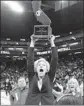  ?? Rich Pedroncell­i AP ?? WINDWARD coach Vanessa Nygaard holds up state title trophy.