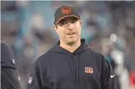  ?? PHELAN M. EBENHACK/ASSOCIATED PRESS ?? Cincinnati Bengals offensive coordinato­r Brian Callahan stands on the field before an NFL football game against the Jacksonvil­le Jaguars on Dec. 4. The Tennessee Titans have agreed to hire Callahan as their head coach, a person familiar with the decision told The Associated Press.