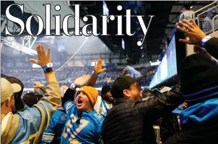  ?? PHOTOS BY EMILY ELCONIN — FOR THE WASHINGTON POST ?? Fans cheer as the Detroit Lions scored the first touchdown of the game vs. the Los Angeles Rams in this year’s playoffs.