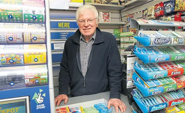  ?? ?? Dave Forbes, owner of Forbes Newsagent, resisted the robber, who eventually made off with thousands of pounds worth of scratchcar­ds.