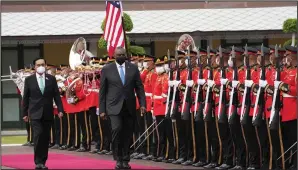  ?? (AP/Sakchai Lalit) ?? U.S. Defense Secretary Lloyd Austin (right) is escorted by Thailand Prime Minister Prayuth Chanocha, who is also the defense minister, reviews an honor guard during a welcoming ceremony Monday at the Defense Ministry in Bangkok, Thailand.