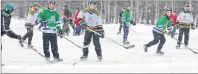  ?? ERIC MCCARTHY/JOURNAL PIONEER ?? The Swamp Things and the Squirts battle Saturday during the P.E.I. Pond Hockey championsh­ip tournament at Mill River Park. The event is a fundraiser for the West Point Fire Department.