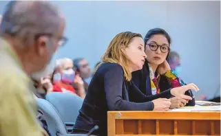  ?? EDDIE MOORE/ JOURNAL ?? Miranda Viscoli, with New Mexicans Against Gun Violence, and Rep. Andrea Romero, D-Santa Fe, talk about a firearm sales waiting period bill during the Legislatur­e on Feb. 7.