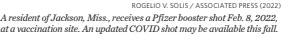  ?? ROGELIO V. SOLIS / ASSOCIATED PRESS (2022) ?? A resident of Jackson, Miss., receives a Pfizer booster shot Feb. 8, 2022, at a vaccinatio­n site. An updated COVID shot may be available this fall.