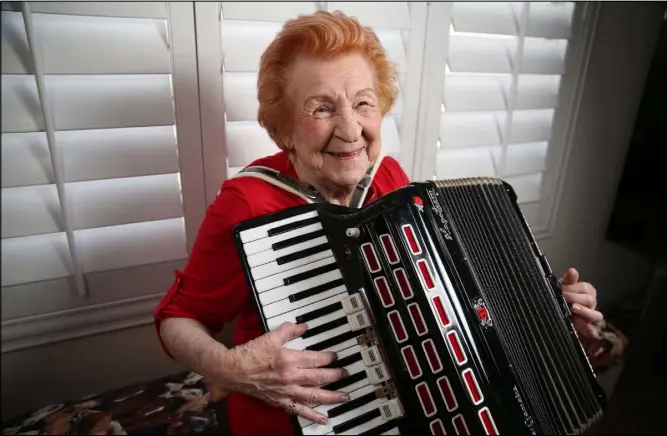  ?? Erik Verduzco Las Vegas Review-Journal @Erik_Verduzco ?? Etta Baykara, 91, plays accordion at her home in Las Vegas. She’s been playing it, and the piano, since childhood.