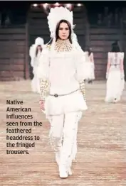  ?? Native American influences seen from the feathered headdress to the fringed trousers. ??