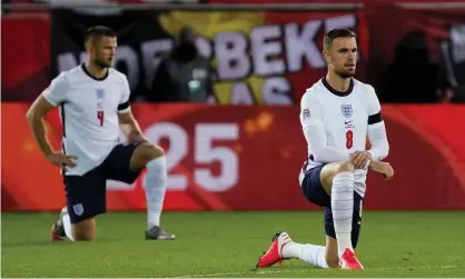  ?? Photograph: Dave Winter/BPI/Shuttersto­ck ?? Jordan Henderson taking the knee before England’s Nations League game in Belgium in 2020.