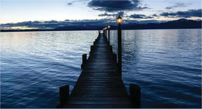  ??  ?? A picture shows a pier over the Chiemsee lake in Seeon-Seebruck in southern Bavaria. — AFP