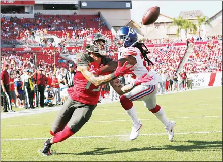 ??  ?? Tampa Bay Buccaneers wide receiver Mike Evans (13) beats New York Giants cornerback Janoris Jenkins on a 21-yard touchdown pass during the first
half of an NFL football game on Sept 22 in Tampa, Florida. (AP)