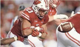  ?? GETTY IMAGES ?? UW tailback Jonathan Taylor fumbled twice in the Badgers’ first two games but now has gone 48 carries without giving up the ball.