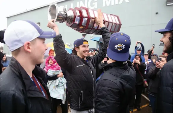  ?? CITIZEN PHOTO BY JAMES DOYLE ?? Prince George Spruce Kings captain Ben Poisson raises the Fred Page Cup over his head on April 18 at Rolling MIx Concrete Arena after the Spruce Kings arrived home after defeating the Vernon Vipers the night before to claim their first BCHL championsh­ip.