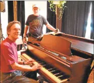  ?? Hearst Connecticu­t Media file photo ?? Bruce MacLeod, Charles Hubert test The Buttonwood Tree’s donated Steinway piano, in Middletown.