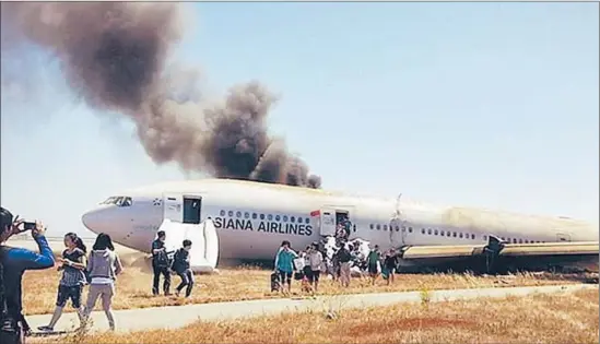  ?? EPA / YONHAP ?? THIS PHOTO was taken by one of the Asiana passengers soon after he escaped from the burning plane, which originated in Shanghai with a stop in Seoul.