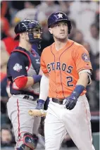  ?? DAVID J. PHILLIP/ASSOCIATED PRESS ?? Houston’s Alex Bregman returns to the dugout after striking out in the fifth inning of Game 7 of the World Series Wednesday.