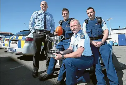  ?? KAVINDA HERATH/STUFF ?? Four members of the Southland police rugby team that won the Police Challenge Cup recently, from left, detective sergeant Mark McCloy and constables Kurt Hodson, Stuart Newton and Josh Suszko.