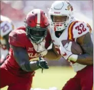  ?? IAN MAULE — TULSA WORLD VIA AP ?? Oklahoma linebacker Kenneth Murray (9) collides with Iowa State running back David Montgomery (32) during an NCAA college football game in Norman, Okla., Saturday. Iowa State defeated No. 3 Oklahoma 38-31.