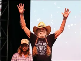  ?? ?? Willie Nelson waves to the crowd before performing during the Palomino Festival at Brookside Park in front of the Rose Bowl in Pasadena on Saturday.