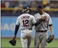  ?? CHRIS O’MEARA — THE ASSOCIATED PRESS ?? Francisco Lindor greets Carlos Carrasco during the seventh inning against the Rays on Sept. 1 in St. Petersburg, Fla.