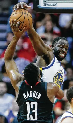  ?? Brett Coomer / Staff photograph­er ?? The Warriors’ Draymond Green brings to an abrupt end a shot attempt by Rockets guard James Harden during the fourth quarter of Wednesday night’s game at Toyota Center.