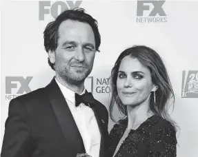  ?? FREDERIC J. BROWN/AFP/GETTY IMAGES ?? Matthew Rhys (“The Americans”) arrives for a party with Keri Russell after being named outstandin­g lead actor in a drama series.