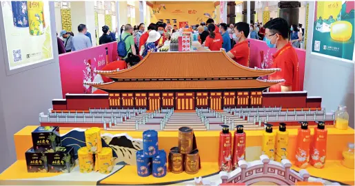  ??  ?? Visitors are attracted by well-packaged products at China’s Time-honored Brands Expo 2020 in Shanghai on October 10, 2020. Many classic domestic products are displayed with innovative changes, and traditiona­l skills are integrated with new technology and popular culture.