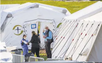  ?? Mary Altaffer / Associated Press ?? Medical personnel work at the Samaritan's Purse field hospital in New York's Central Park on Wednesday.