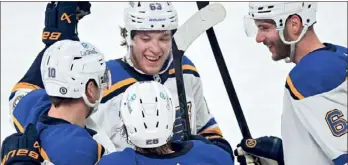  ?? (GRAHAM HUGES/ THE CANADIAN PRESS VIA AP) ?? St. Louis Blues' Jake Neighbours (63) celebrates with teammates after scoring against the Montreal Canadiens during third period of Sunday’s game in Montreal.