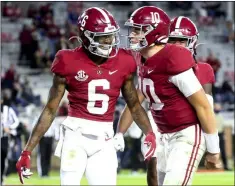 ?? GARY COSBY JR - THE ASSOCIATED PRESS ?? FILE - In this Oct. 31, 2020, file photo, Alabama wide receiver DeVonta Smith (6) and quarterbac­k Mac Jones (10) celebrate a touchdown pass during the second half of an NCAA college football game against Mississipp­i State in Tuscaloosa, Ala.