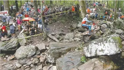  ?? ROBERT LYNN PHOTO ?? The course challenges riders with boulders, rock-littered paths, fallen logs and other natural obstacles.