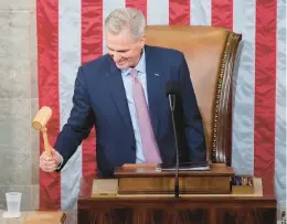  ?? ANDREW HARNIK/AP ?? Incoming House Speaker Kevin McCarthy, of California, holds the gavel after accepting it from House Minority Leader Hakeem Jeffries on the House floor at the U.S. Capitol.