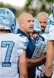  ?? Brian A. Pounds/Connecticu­t Post ?? Oxford football coach Joe Stochmal huddles with his team before playing Seymour on Sept. 21. Stochmal, the only coach in the history of the Oxford program, is stepping down after 17 seasons.