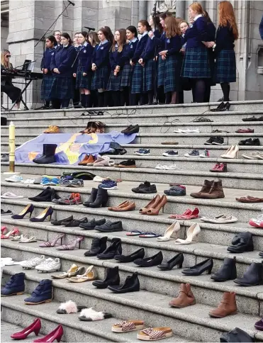  ??  ?? Shoes worn by those who died from suicide on the steps of St Peters.