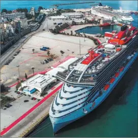  ?? ?? Luxury cruise ships dock in a terminal at Greece’s Piraeus Port in July.