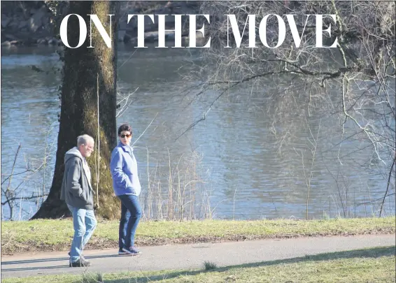  ?? MICHILEA PATTERSON – FOR MEDIANEWS GROUP ?? People walk the Schuylkill River Trail, which runs alongside the Schuylkill River, at Pottstown Riverfront Park.