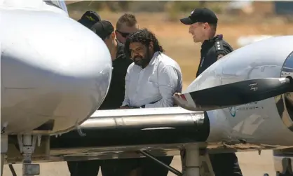  ?? Photograph: Tamati Smith/Getty Images ?? Terence Kelly, the alleged abductor of Cleo Smith, boarding a plane after being taken into custody.