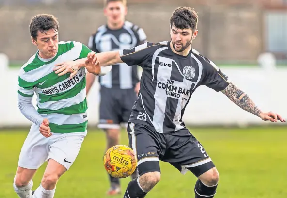  ??  ?? AMBITION: Sam Mackay, right, playing for Wick against Buckie, would love for his current club Golspie Sutherland to win their place in the HFL.