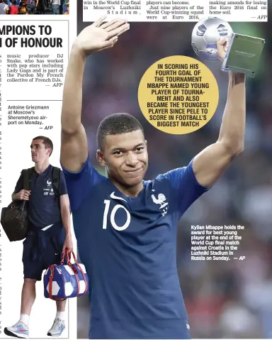  ?? AP ?? Kylian Mbappe holds the award for best young player at the end of the World Cup final match against Croatia in the Luzhniki Stadium in Russia on Sunday. —