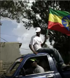  ?? Ed Ou/The New York Times ?? In this 2010 file photo, supporters of the Ethiopian People’s Revolution­ary Democratic Front rally in cars with the national flag in Addis Ababa.