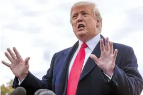  ?? AP PHOTO/J. SCOTT APPLEWHITE ?? President Donald Trump talks to reporters Wednesday on the South Lawn of the White House about wanting to change the Fourteenth Amendment