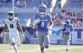  ?? JOE RONDONE/THE COMMERCIAL APPEAL ?? Memphis receiver Calvin Austin III strolls in for a touchdown against South Florida during their 2020 game.