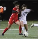  ?? MIKE BUSH/NEWS-SENTINEL ?? Galt's Isabella Minatre (7) and Tokay's Odyssi Garcia (5) battle for the ball at Walker Park in Galt on Dec. 3, 2018.