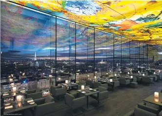  ?? Foto: Klemens Horvath ?? Klemens Horvath lichtete das von Jean Nouvel entworfene Gebäude (im Bild das Restaurant „Das Loft“im 18. Stock) im Auftrag des Hotels 2011 ab. Die Deckengest­altung stammt von der Schweizer Medienküns­tlerin Pipilotti Rist.