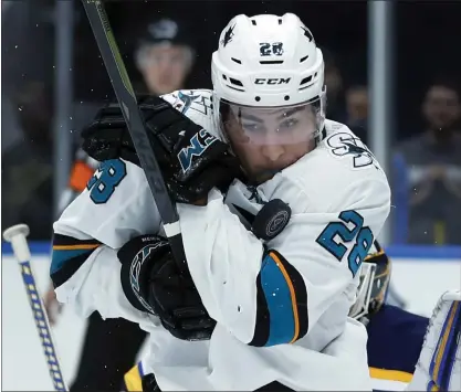  ?? JEFF ROBERSON — THE ASSOCIATED PRESS ?? The Sharks’ Timo Meier takes a puck to the shoulder in the third period of Friday’s 4-0loss to the Blues in St. Louis.