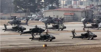  ?? YONHAP PHOTO VIA AP ?? PREPARING TO FLY
United States Army Apache helicopter­s take off at Camp Humphreys in the city of Pyeongtaek, northweste­rn South Korea, on Monday, March 4, 2024.