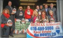  ??  ?? Nicole Roman, broker John E. Ohler Sr., Suzanne Jurenko, Mike Richter, Kathy Cicala, Finance of America Lender Scott Tomlinson, Marcia Singh, Brent Harris, Don Peters, Donna Russell and Nancy Peters pose with donations for Daily Bread Community Food...