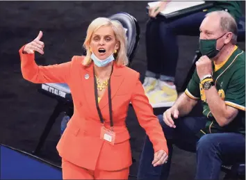  ?? Eric Gay / Associated Press ?? TOP: UConn coach Geno Auriemma calls out to his team during the first half against Iowa on Satuirday. BOTTOM: Baylor coach Kim Mulkey calls to her players during Saturday’s game against Michigan.