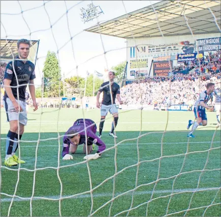  ??  ?? PUTTING THE TIN LID ON IT: The Falkirk players look shellshock­ed as Greg Kiltie scores his second of the game