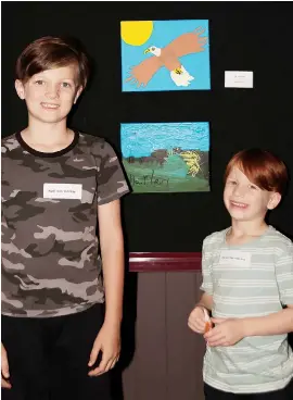  ??  ?? Drouin South Primary School students Raffi (left) and Harlen Van Venrooy stand with their entries at the opening night of the Ficifolia Art Show.