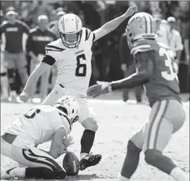  ?? Jayne Kamin-Oncea Getty Images ?? THE CHARGERS’ Caleb Sturgis kicks a 48-yard field goal to tie the score 17-17 in the first half Sunday. He was unsuccessf­ul on a field goal and two extra points.